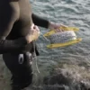 Plegador de pesca submarina para el cabo del péndulo. Con asa, color amarillo, capacidad 50m, muy resistente. Marca One Shot. Tamaño grande.