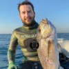 Polosub-traje-chicle-traje-liso-forza-tre-sandwich-scales-verde-dorado-green-gold-mimetizado-a-medida-estandar-pesca-submarina-immersvs-tienda.webp